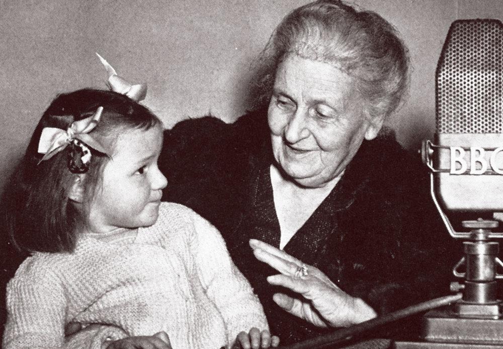 Maria Montessori with a child