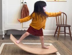 Girl balancing on a board
