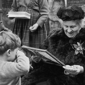 Maria Montessori working with a children