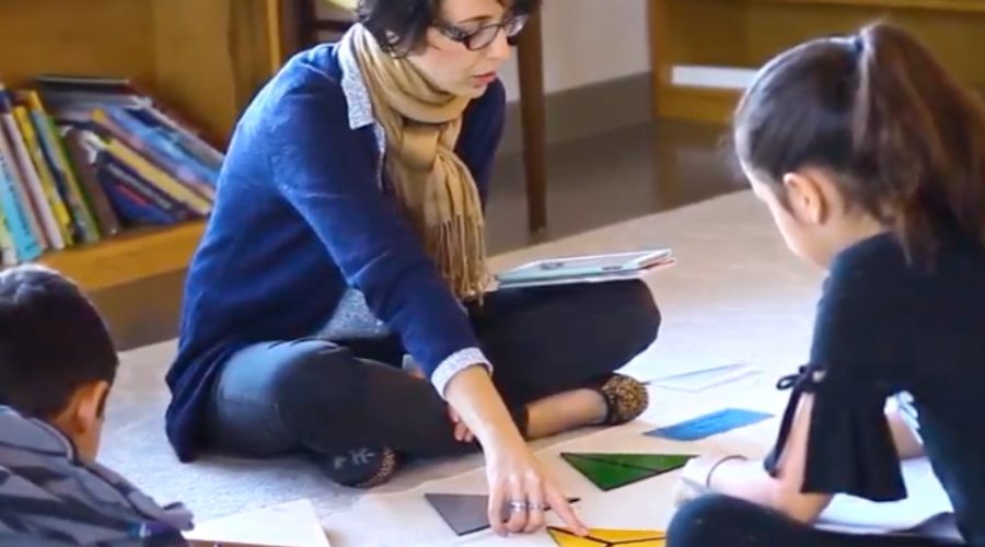 A Montessori Elementary School guide leading a lesson