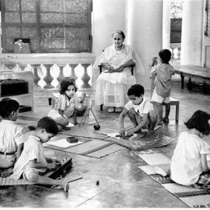 Maria Montessori working with children