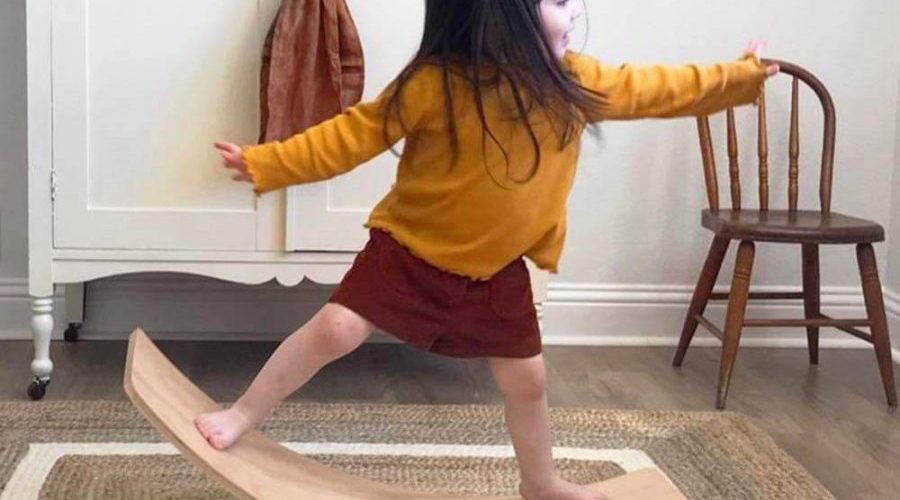 Girl balancing on a board